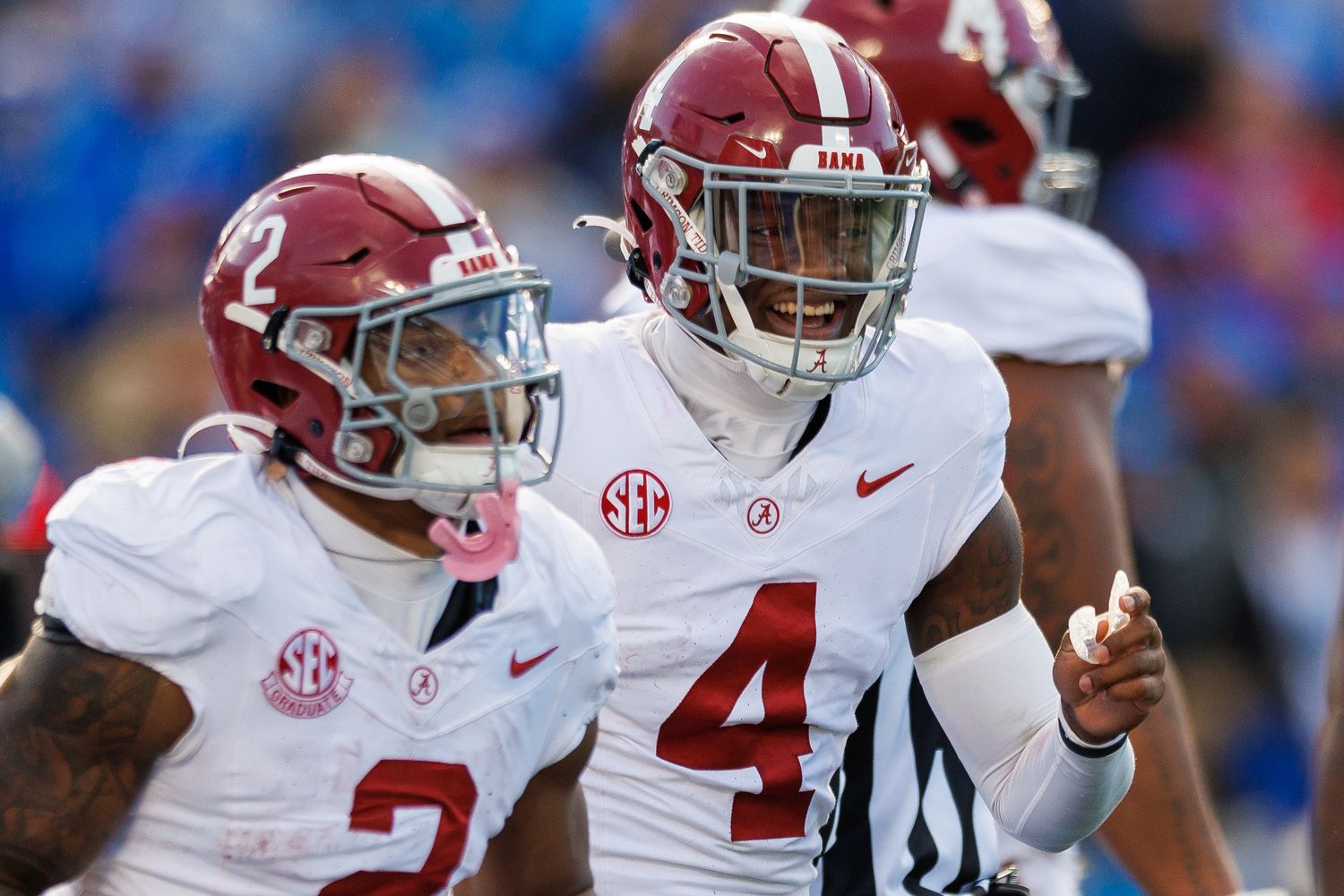 Nov 11, 2023; Lexington, Kentucky, USA; Alabama Crimson Tide quarterback Jalen Milroe (4) smiles as he runs back to the sideline during the third quarter against the Kentucky Wildcats at Kroger Field.